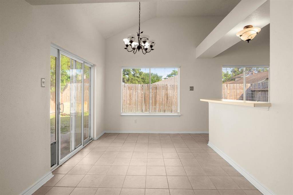Spacious breakfast nook with sliders to the patio.