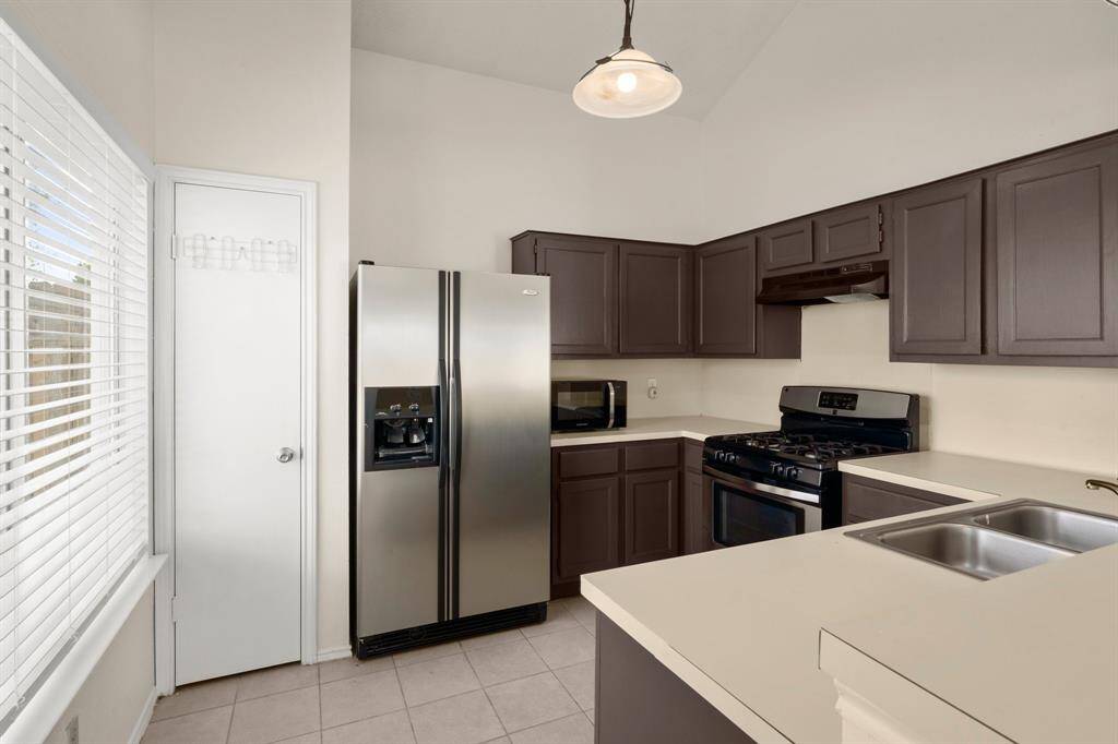 Efficient kitchen with microwave and refrigerator included!