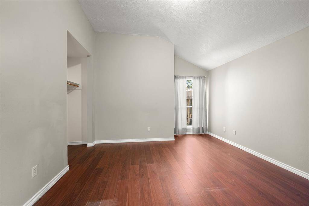 Primary bedroom with no carpet.