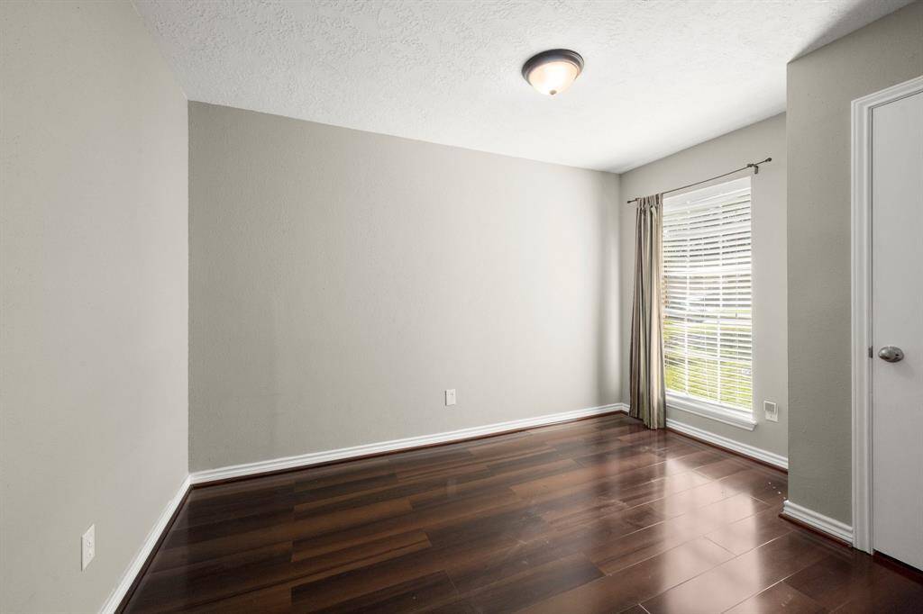 Bedroom #2 with no carpet.
