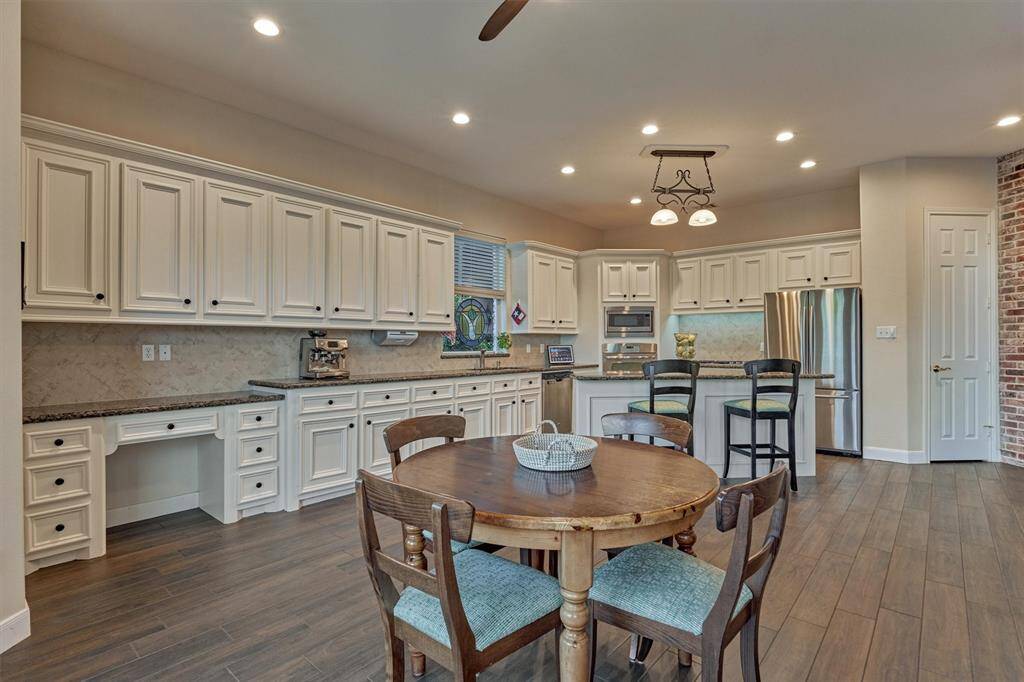 A look back at the kitchen shows the multitude of cabinet and counter space, ideal for storage and meal prep.