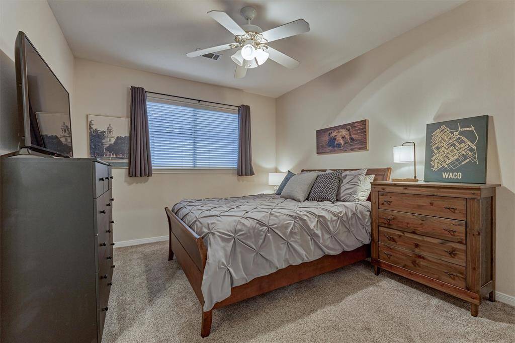 The third guest bedroom offers a walk in closet, private sink area and shared Hollywood bath with another bedroom.