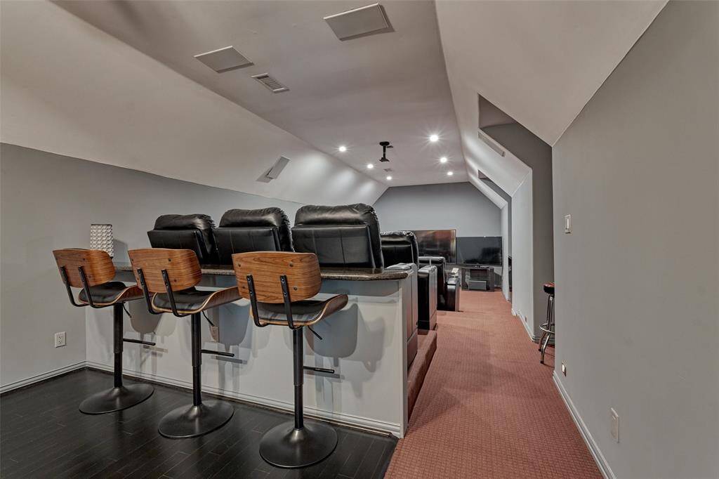The theater room is the perfect place to enjoy your favorite movies or catch the big game with friends in a comfortable, cinematic setting.