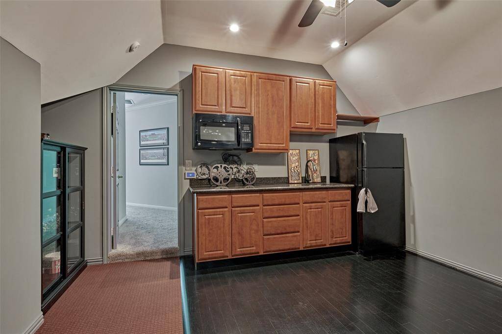 The built-in kitchenette is equipped with a sink, microwave, and refrigerator, offering convenient access to refreshments while you relax and entertain.