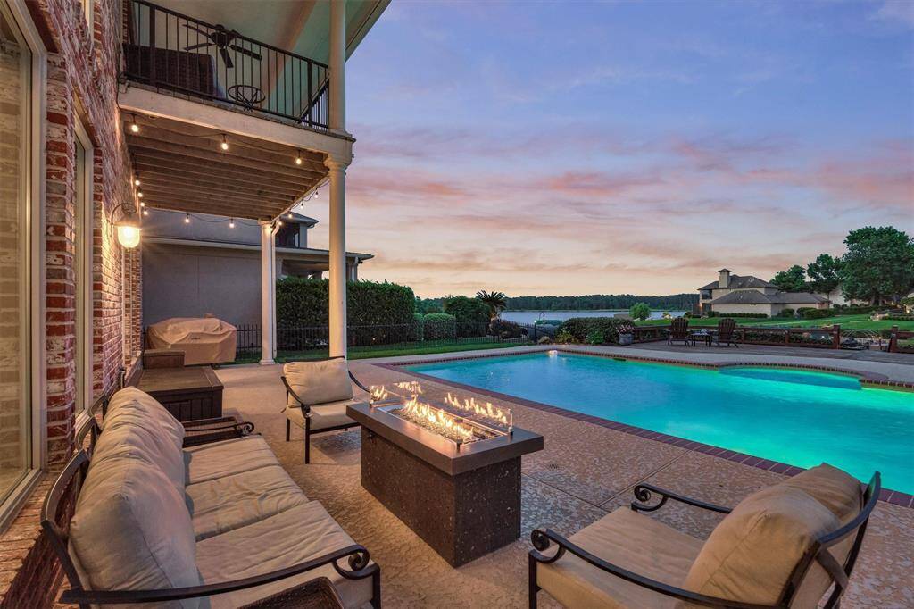 The outdoor space has a covered porch along the entire back of the home. Eastern exposure ensures shaded and peaceful afternoons and evenings by the pool.