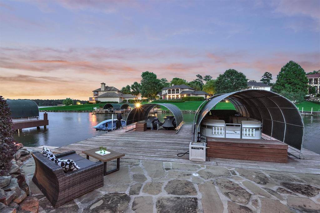 The flagstone patio and deck provide space for lounging, fishing, and other outdoor activities.