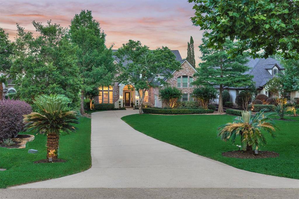 The beautifully landscaped front yard offers a warm and inviting welcome to both homeowners and guests, setting the tone for the elegance found throughout the property.