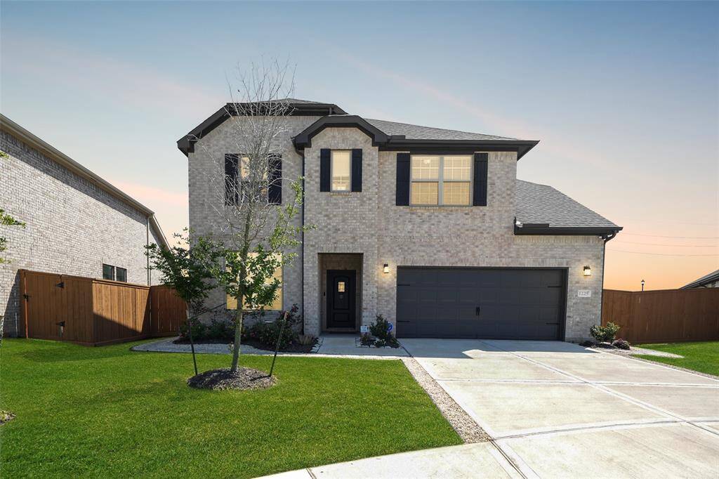 Welcome Home! Stunning brickwork adds timeless charm and curb appeal.