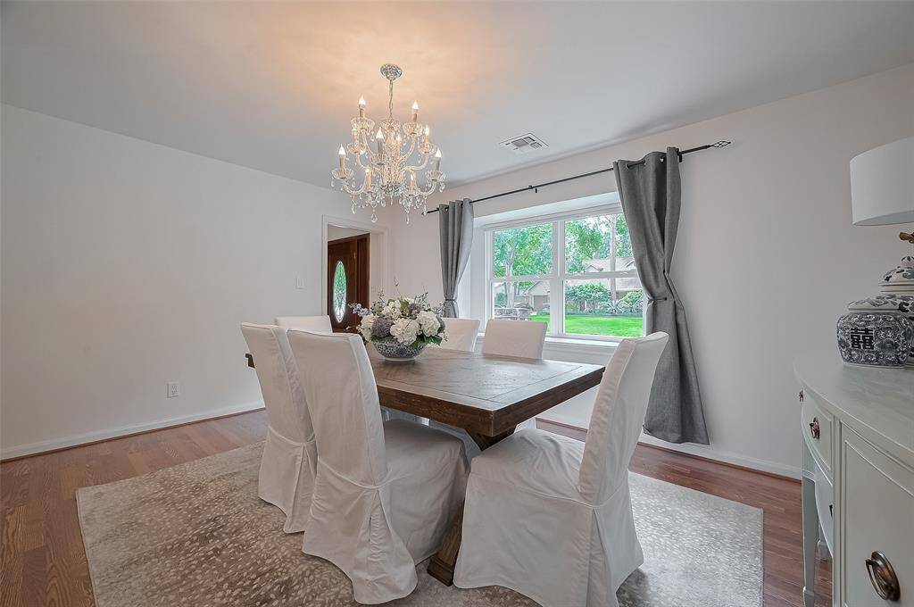 The dining room is filled with natural light and another beautiful view of the front yard. Perfect for welcoming guests as they arrive.