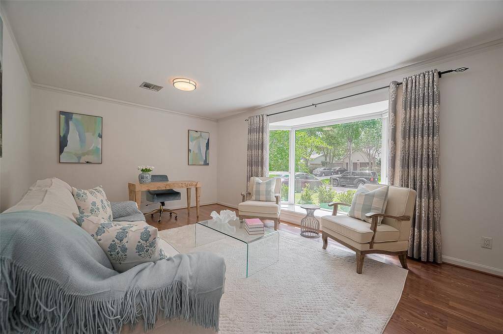 The front formal living room has a beautiful bay window with views of the front yard.