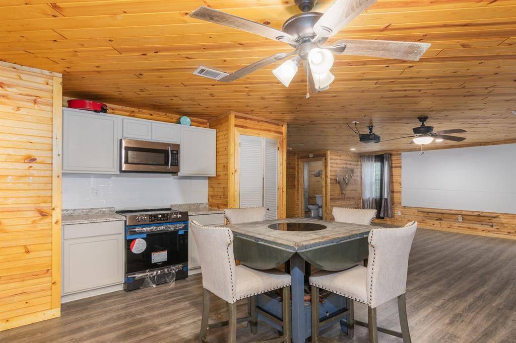 Cabinets and pantry space allow ample storage while openess allows you to enjoy a movie while eating/cooking
