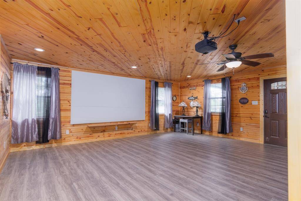 spacious living room with side entry from carport