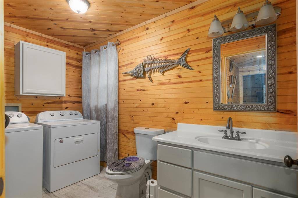 Half bath off of living room houses the washer/dryer connections
