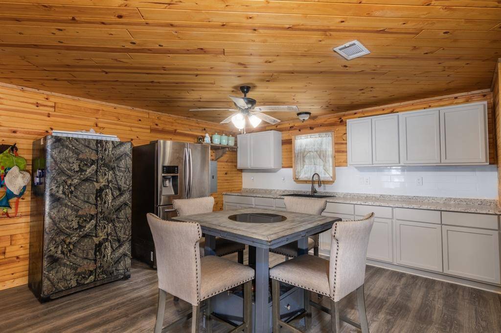 Kitchen can hold a large freezer and refrigerator.