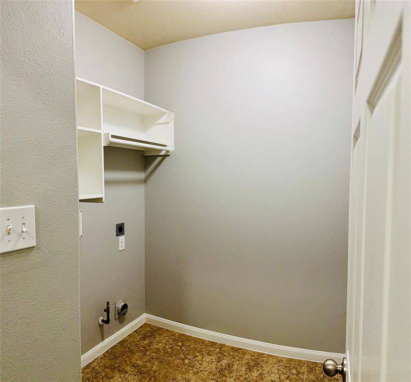 Efficiently designed laundry room with ample storage and perfect for seamless organization and convenience.