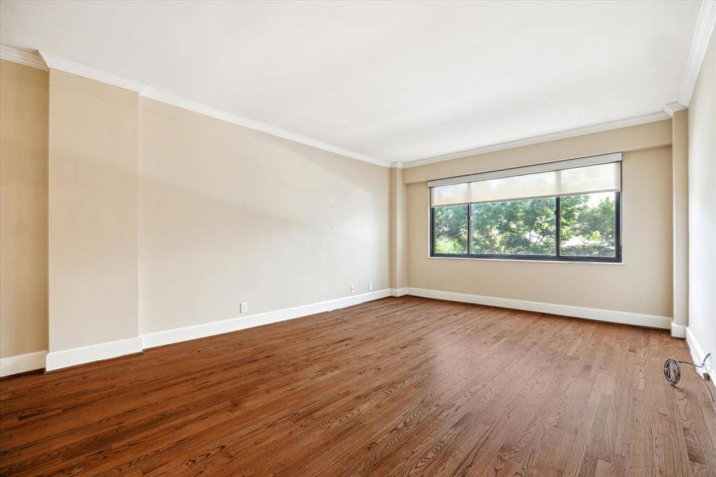 As you enter this lovely condo you will enjoy the abundance of natural light from the large windows and the great hardwood floors.