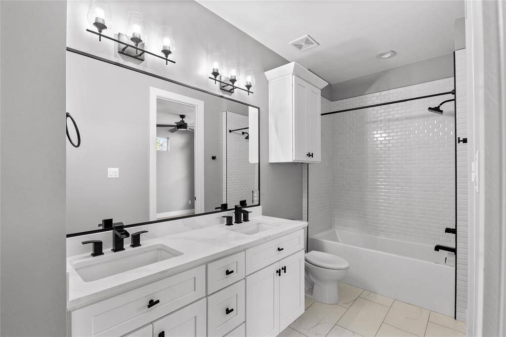 The beautifully designed Jack-and-Jill bath features a dual-sink vanity, ensuring easy mornings for everyone.