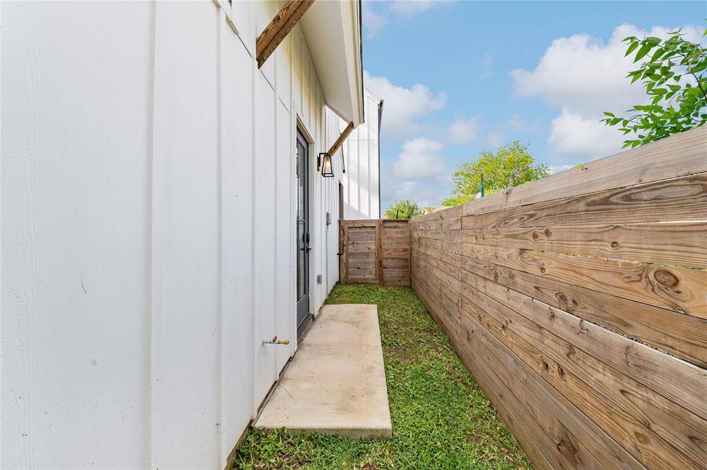 Side yard off of the main open concept living area with gas tap for outdoor grill.