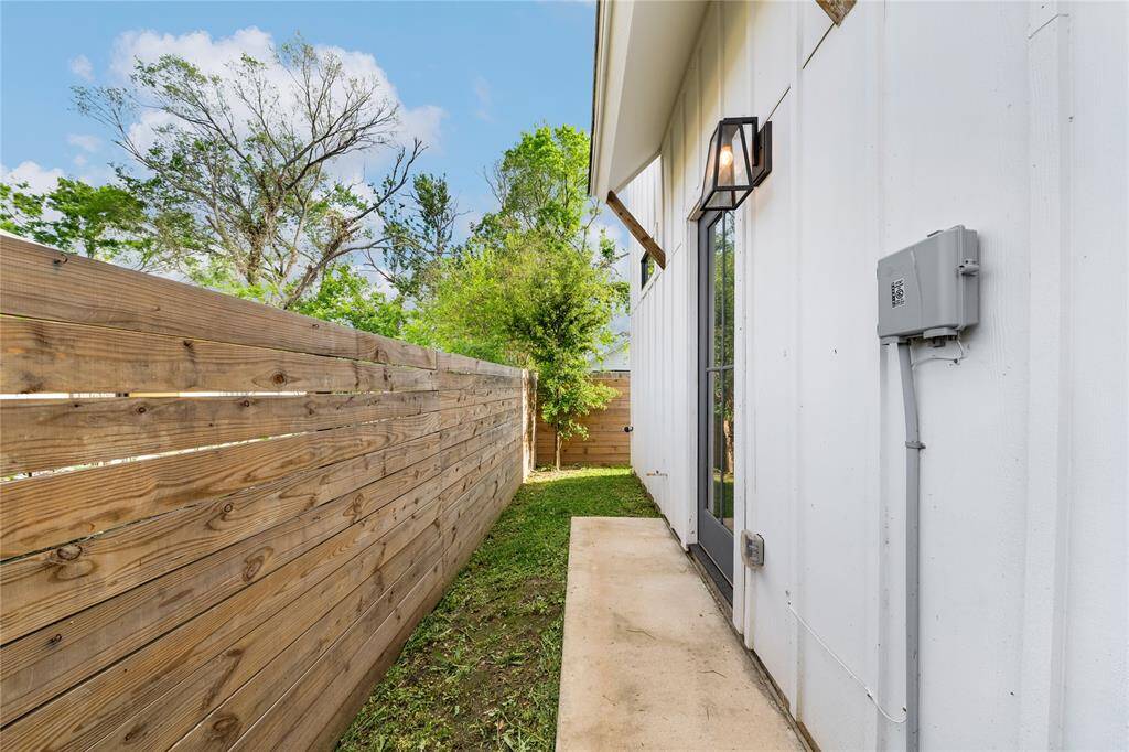 The fully fenced yard offers a secure and serene space, perfect for relaxing, entertaining, or letting pets play freely.