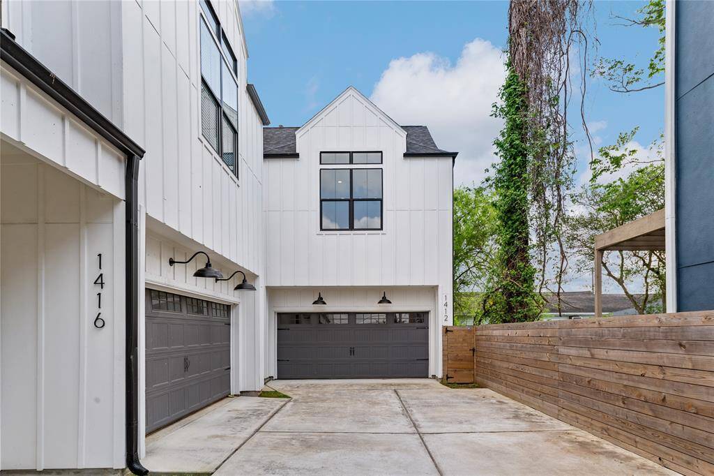 The wide driveway offers ample parking and effortless access to the home, making daily comings and goings a breeze.