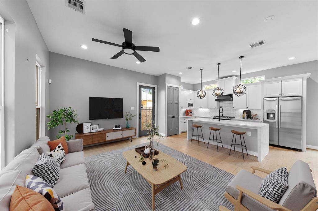 The open-concept living and dining area offers effortless flow, perfect for hosting gatherings or cozy nights in. Virtually Staged.