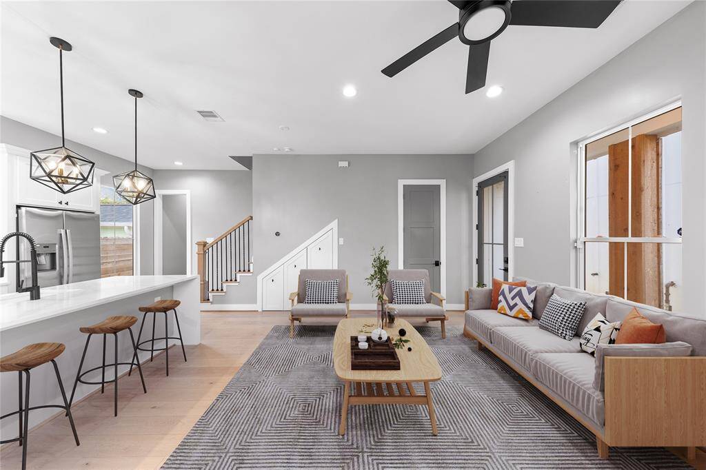 The kitchen’s airy layout effortlessly blends into the living space, making gatherings effortless and inviting. virtual Staged.