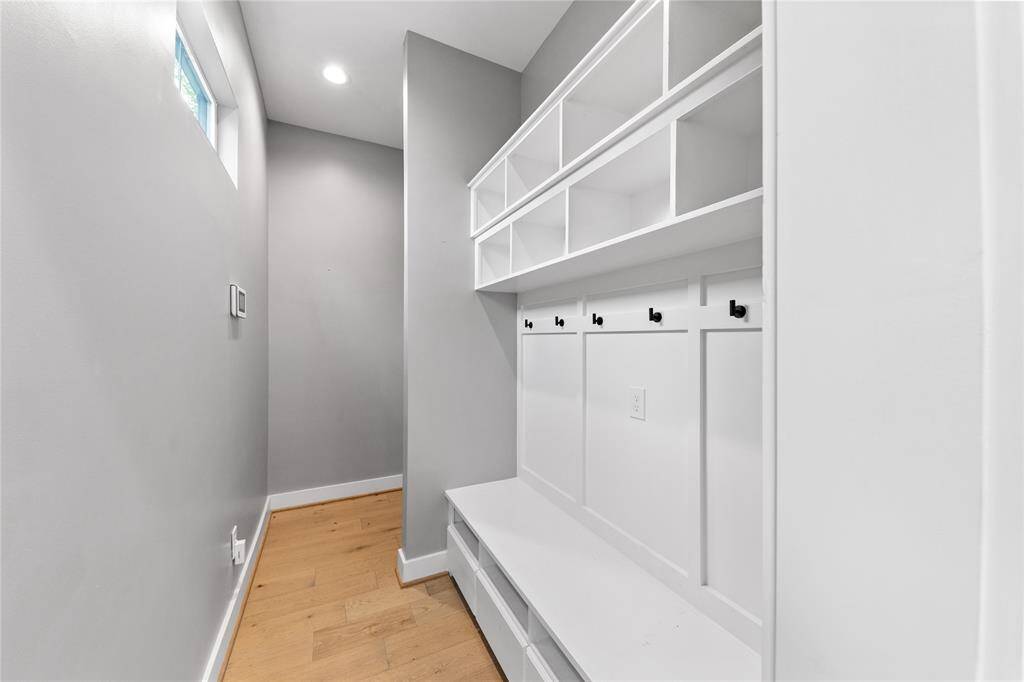 A drop zone/mud room located just off of the entrance of the home from the garage.