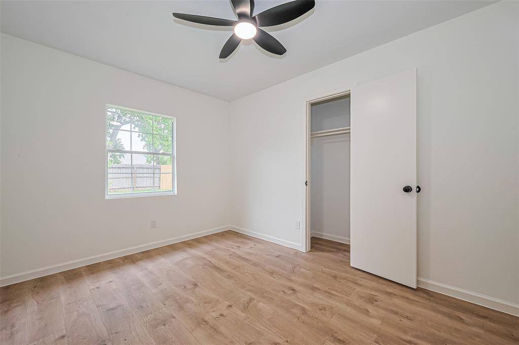 11x10 secondary room with new floor, paint and remote controlled fan