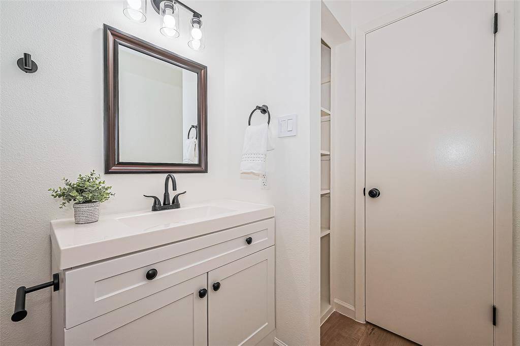 Full vanity and storage space in the primary bathroom