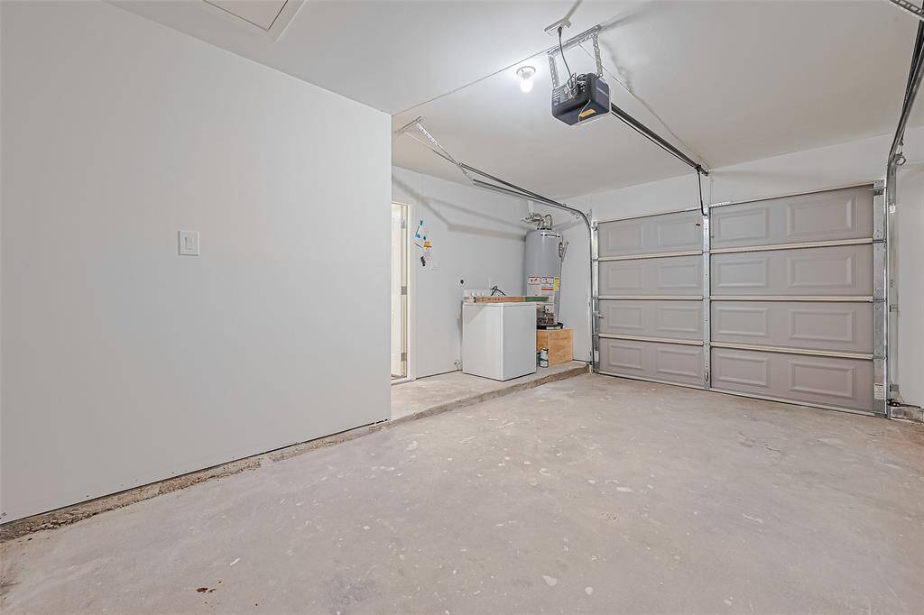 One car garage with new garage door and new automatic door opener.