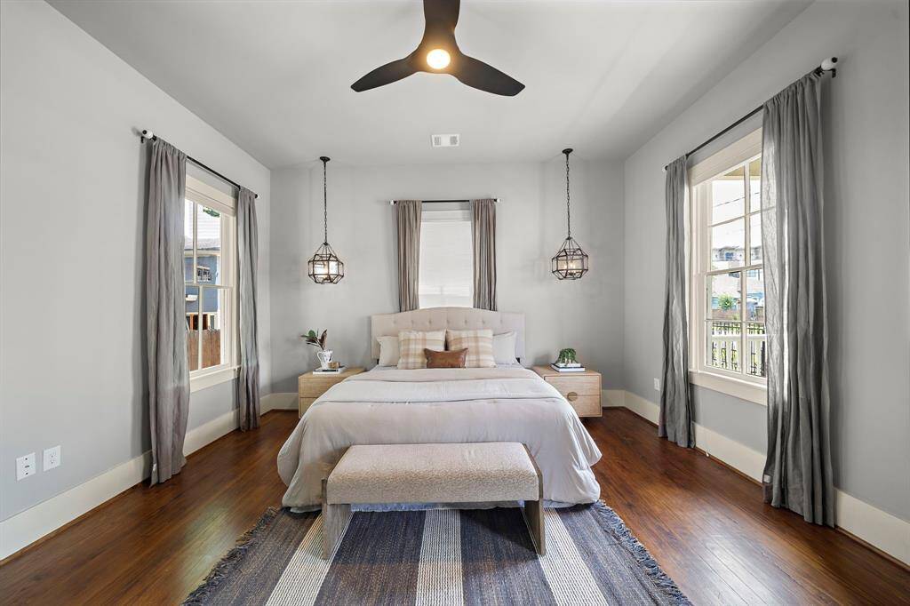 Spacious primary bedroom with "smart" ceiling fan. Restoration Hardware bedside lights! Plenty of room for dresser or additional seating