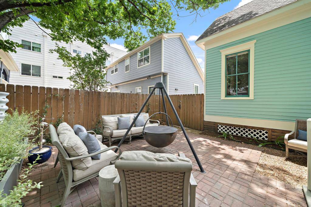 Plenty of mature trees offering plenty of shade in this patio area and backyard!