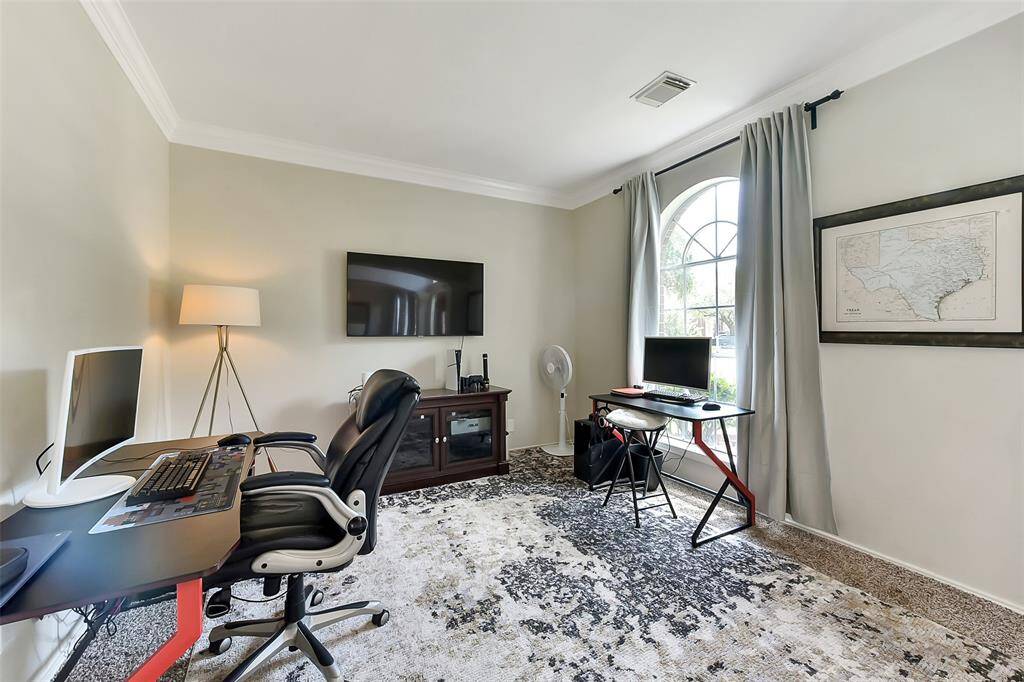 Formal living area that can be utilized as a home office/study.