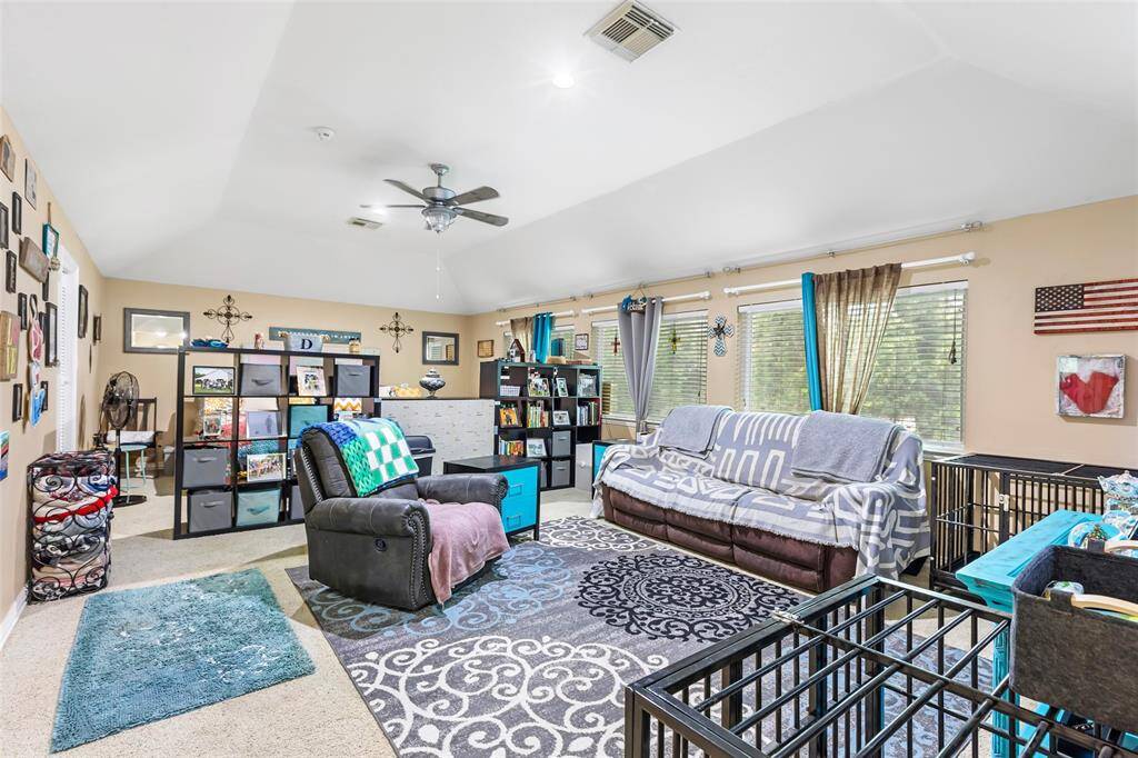 Upstairs flex/game room is currently being used as an in-law suite and is large enough to accommodate both bedroom and living room spaces. Current owners added a walk-in closet to complete the suite.