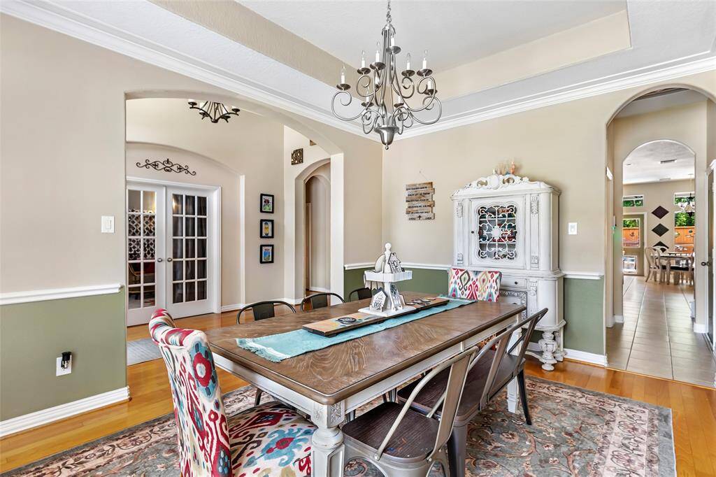 Formal dining has a pass through to the kitchen with laundry and garage access.
