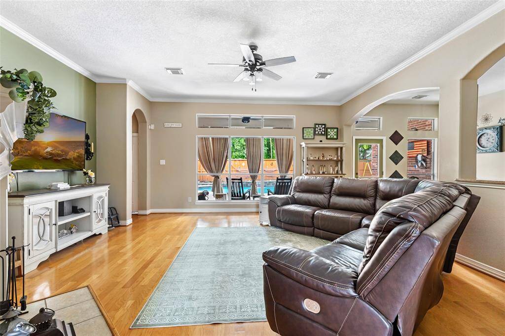Spacious living room over looking the sparkling pool.