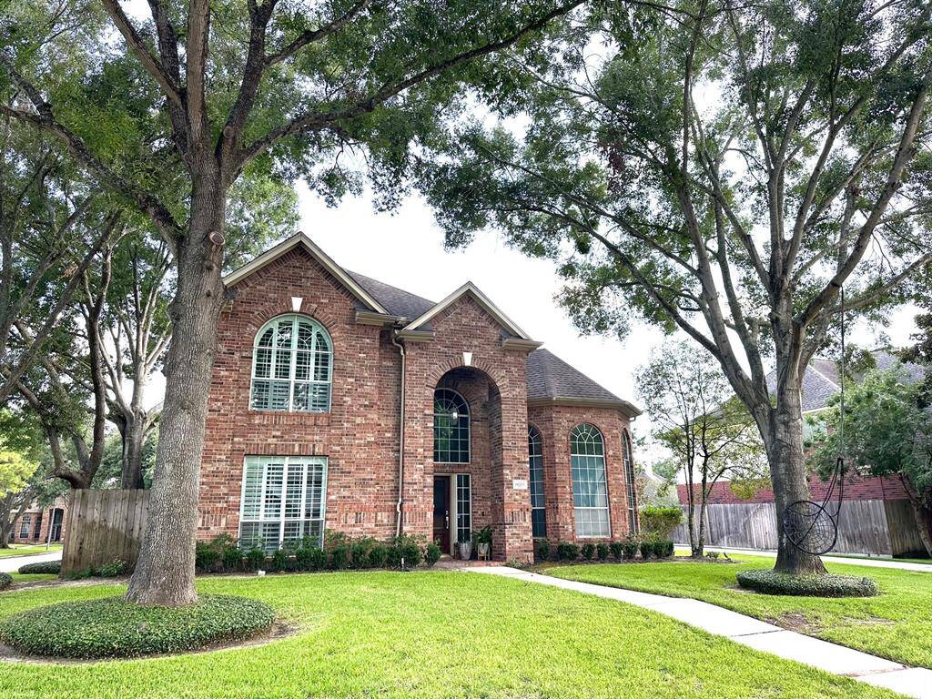 Beautiful trees invite you to this lovely home