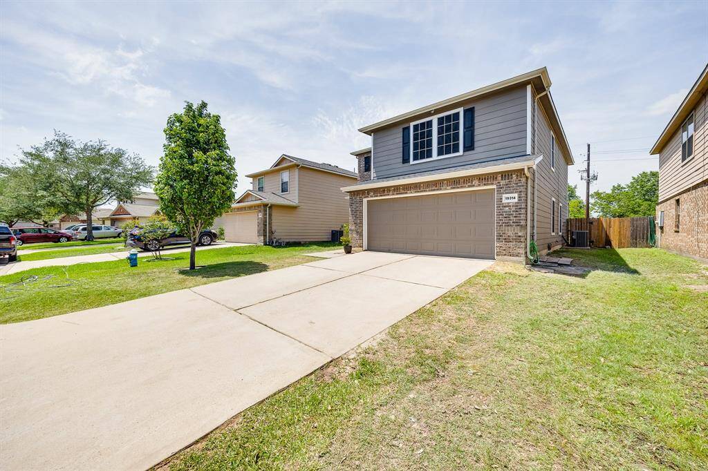 Double attached garage provides secure parking and additional storage space with convenient home access.