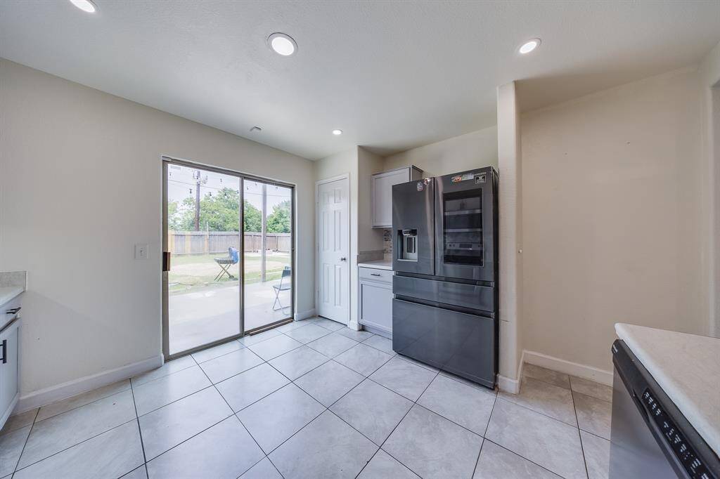 Pantry with plenty of room offers organized storage for groceries and kitchen supplies. The refrigerator is included!