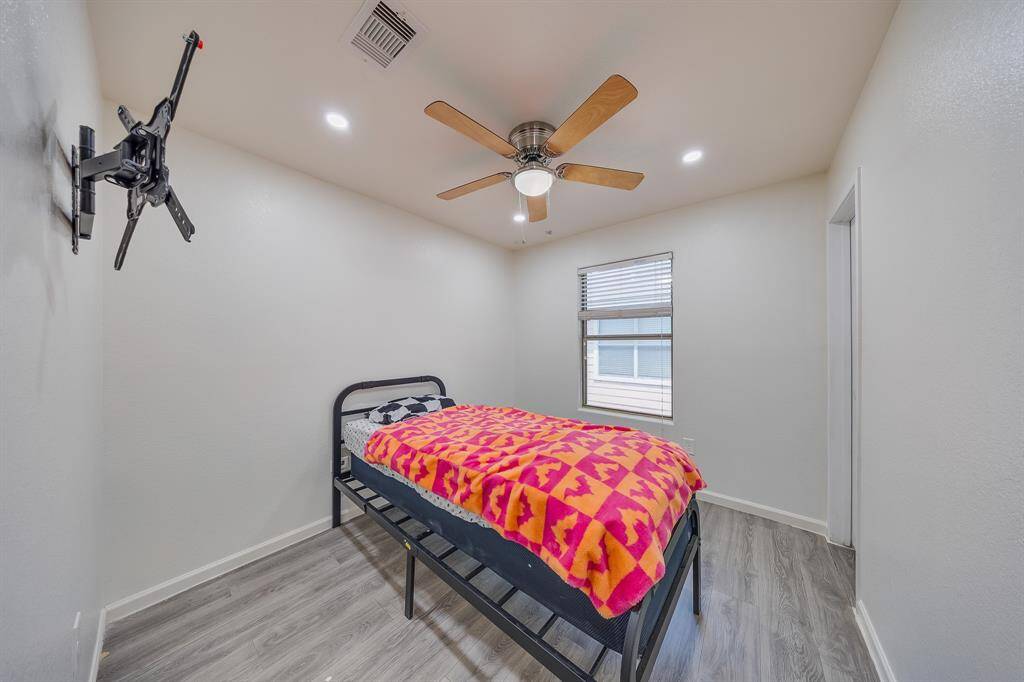 Warm light fills bedroom #3, creating a bright and inviting atmosphere.