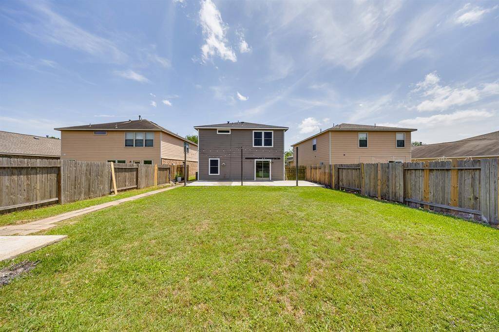 The yard is a blank canvas, ready for the new owner to create their perfect outdoor oasis.