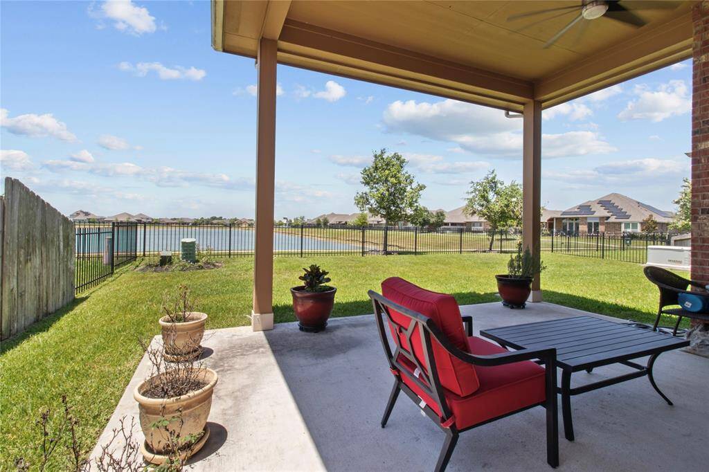 Staycation at home with view of the lake from your custom covered patio!