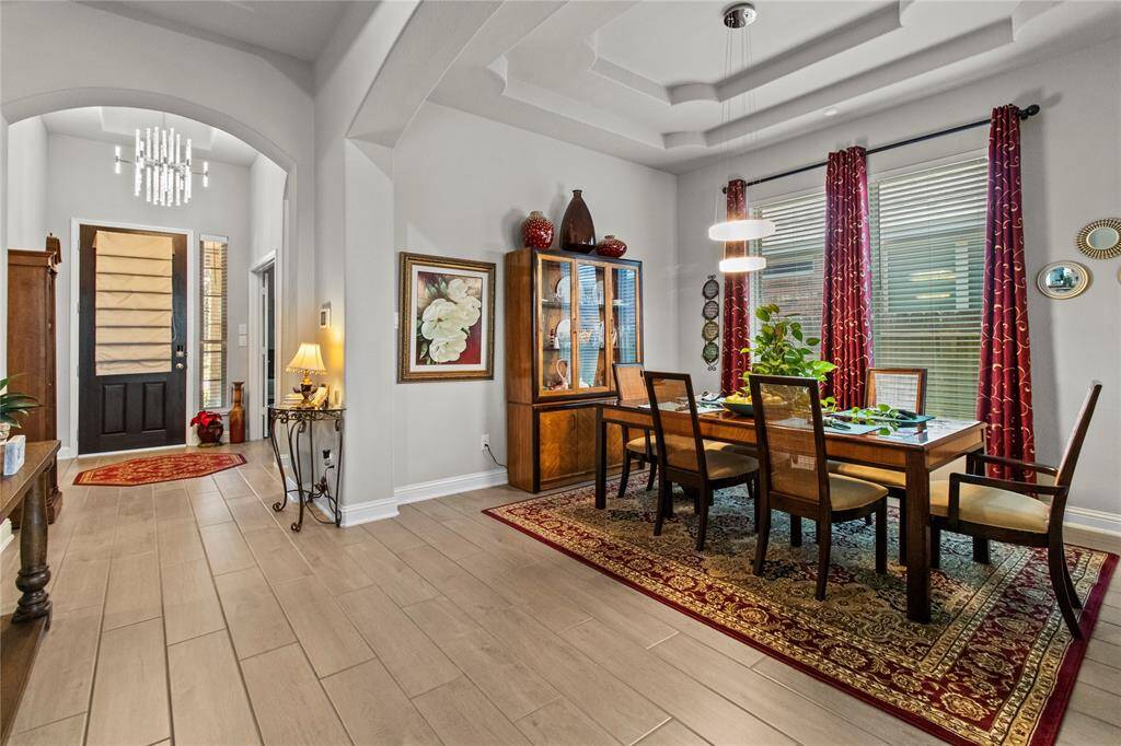 Elegant formal dining area with coffered ceilings