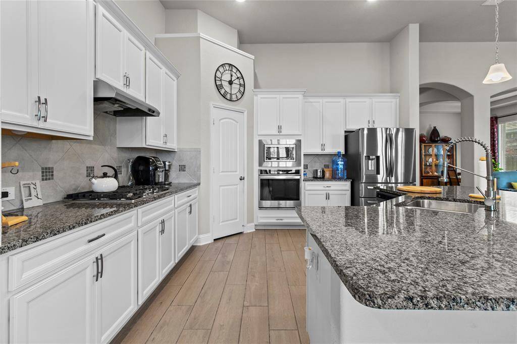 Chef's kitchen with a ton of counter space and granite counters
