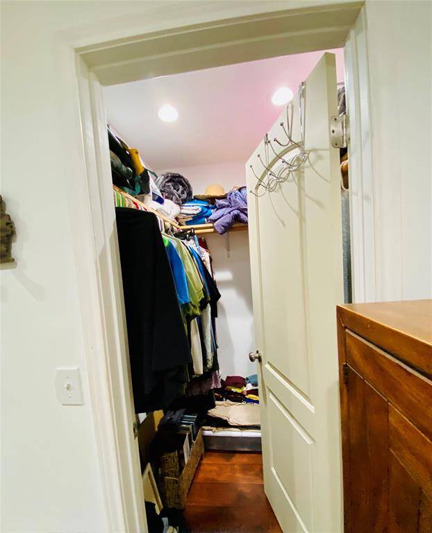 Primary bedroom walk-in closet