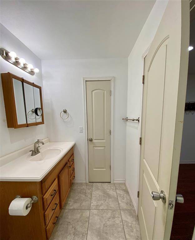 View from primary shower to the linen closet