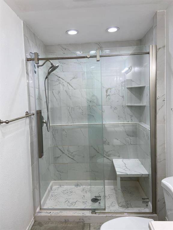 What a fantastic updated primary shower, light and bright