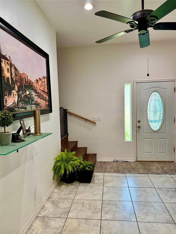 Main entry into the large mudroom showing the stairs to the 2nd floor living area