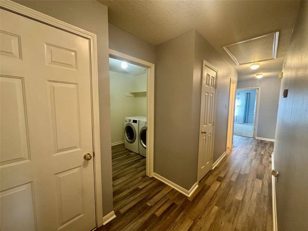 Hall to extra bedrooms and laundry room.