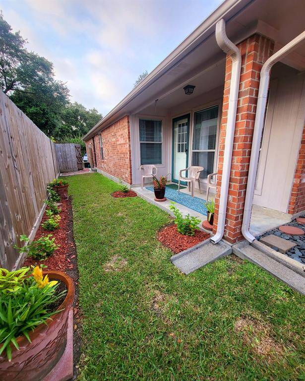 Side yard has a covered patio area and great evening shade.